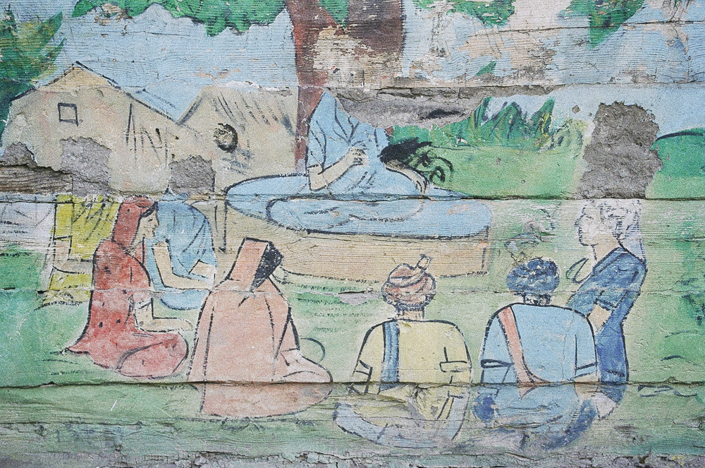 wall painting of buddha and followers