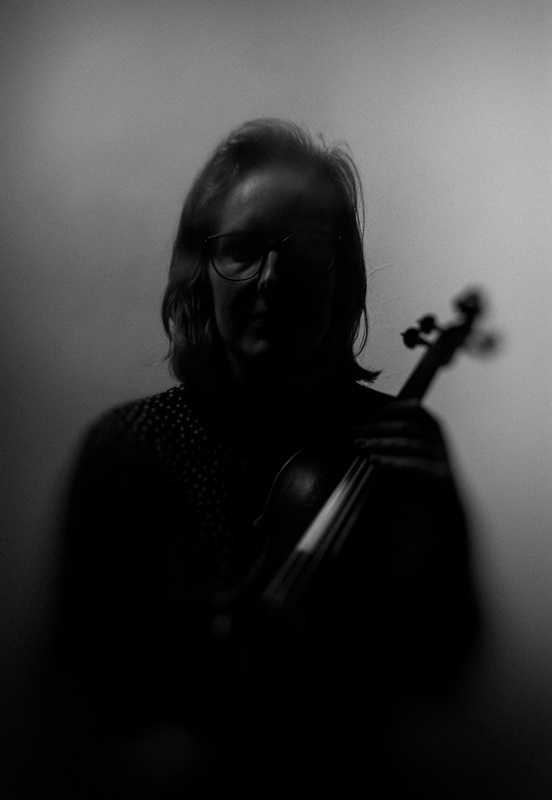 moody violinist in monochrome