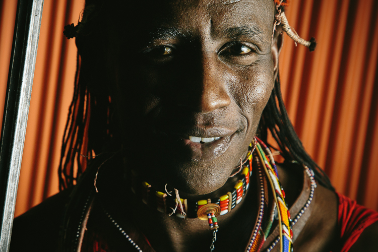 smiling Maasai man with sword