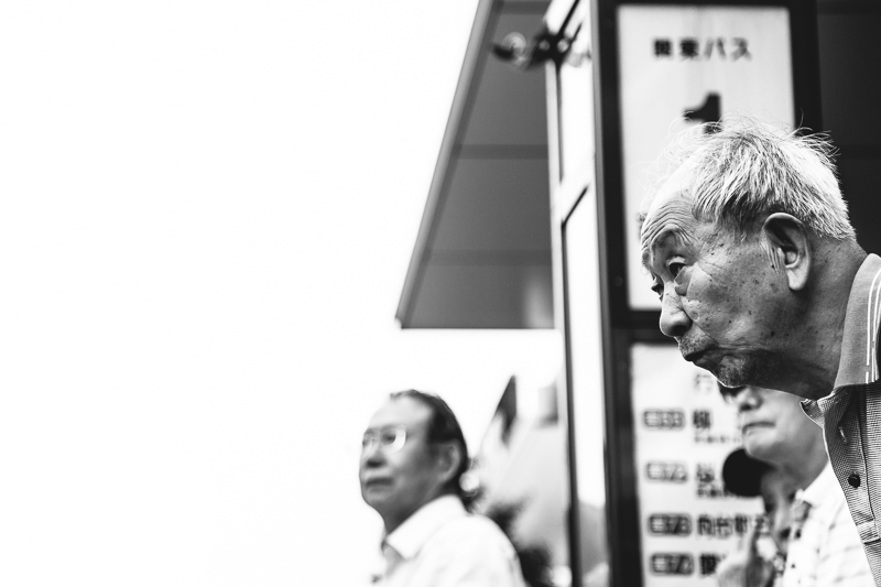 elderly Japanese man watches performance