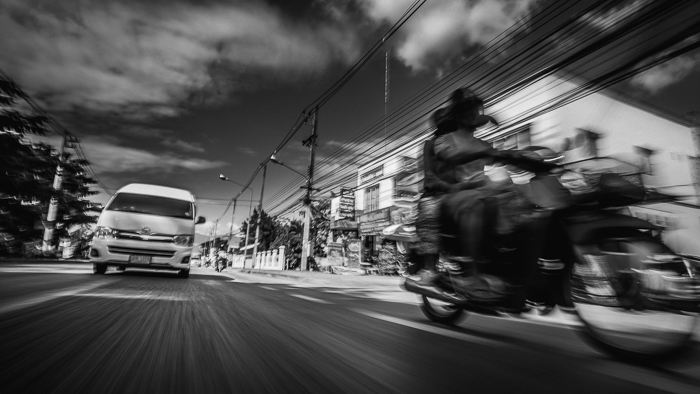 van and motorcycle on street