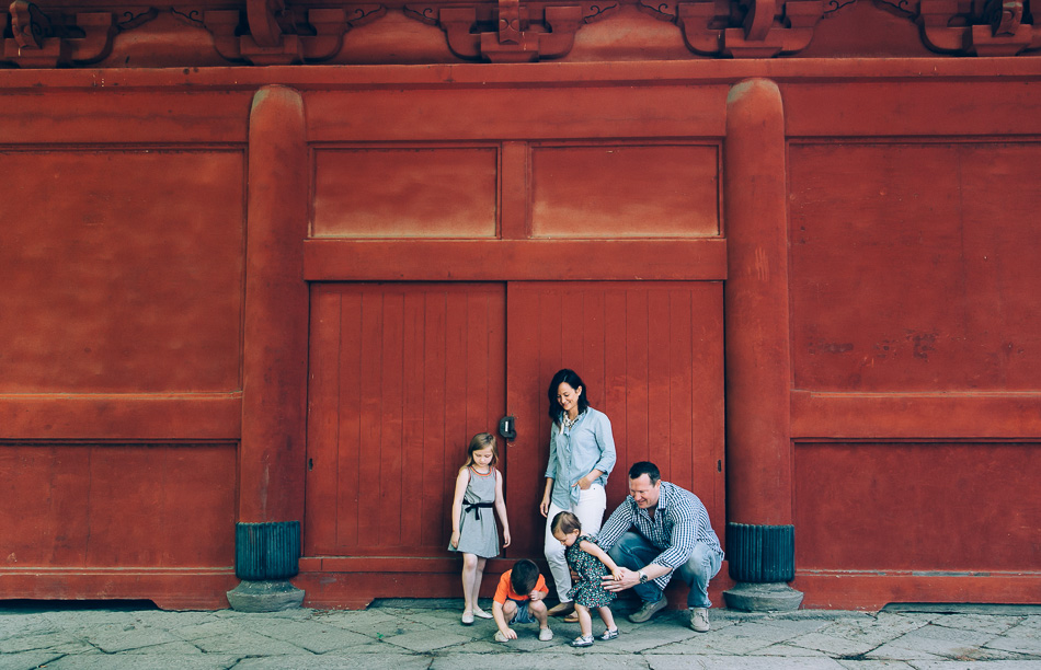 Family in front of temple walls