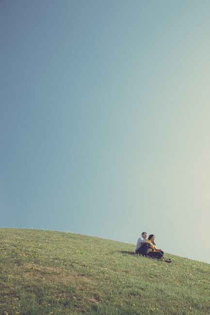 couple sitting on a hill