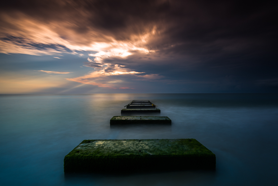 long exposure seascape with beautiful clouds sweeping by