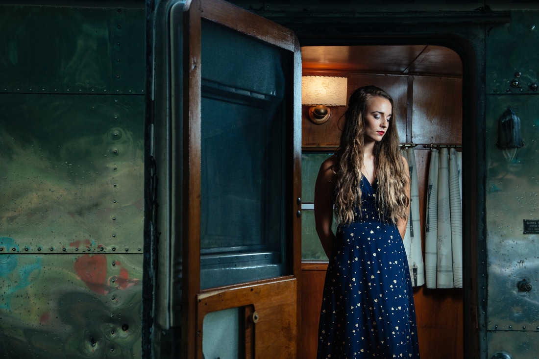 woman in dress inside Airstream