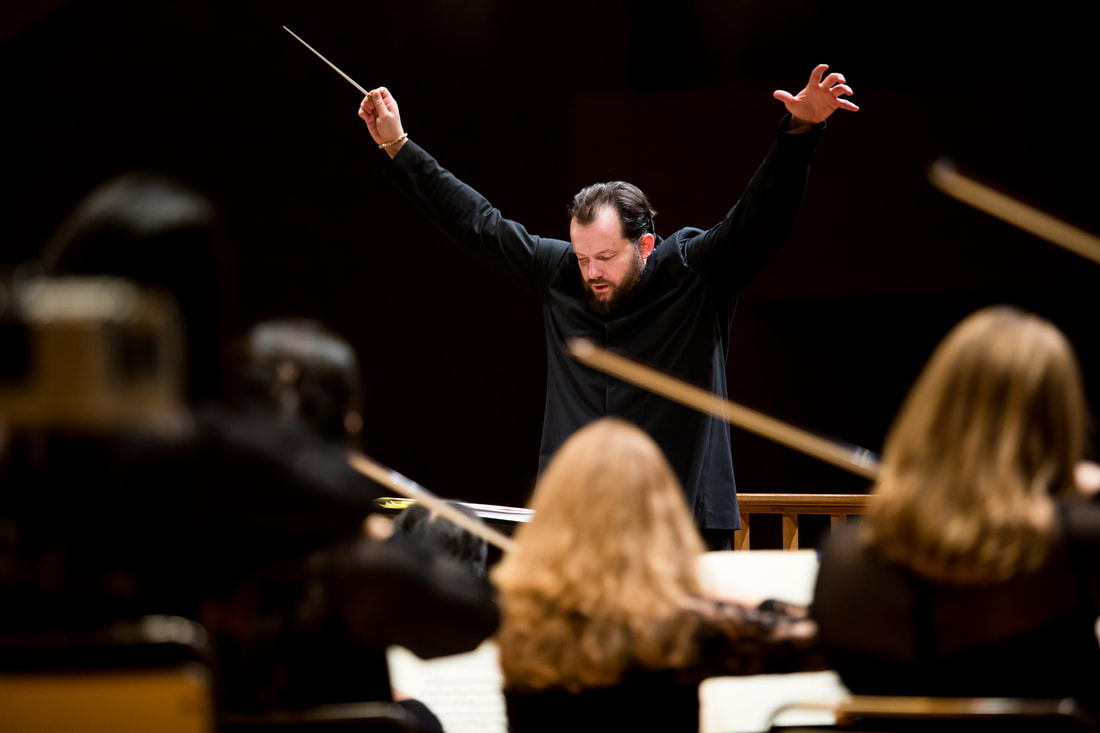 Andris Nelsons with arms wide
