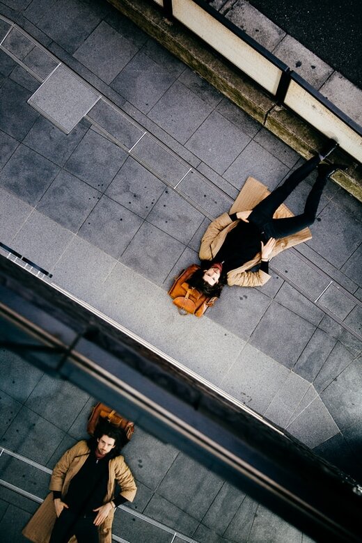Steve Wilcox laying on Harajuku sidewalk