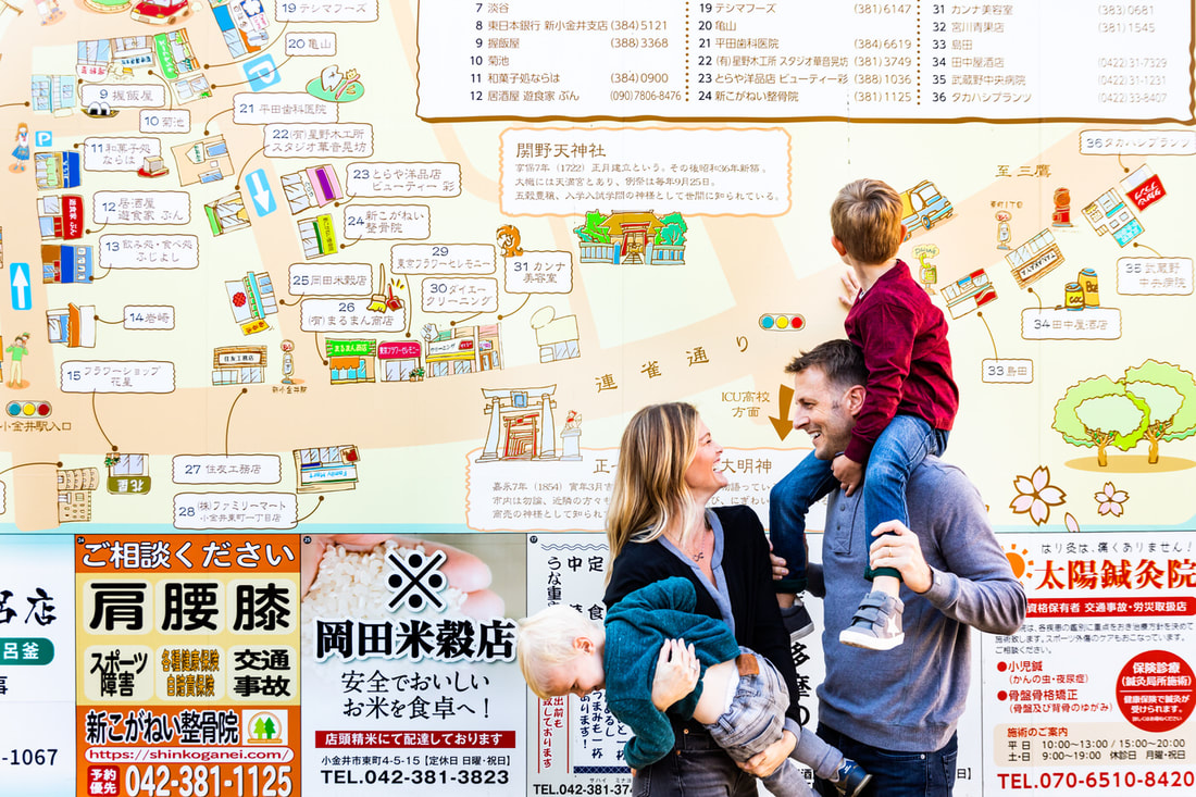 family in front of neighborhood map