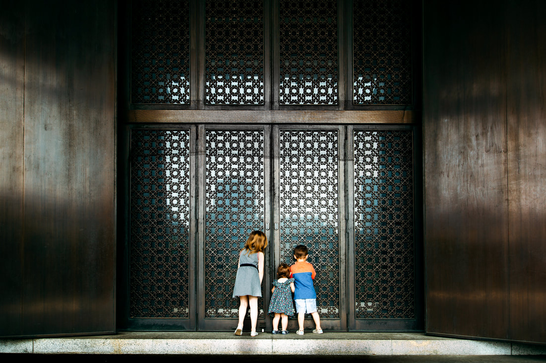 Kids peering into temple