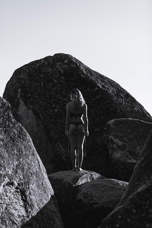 Kaitlin standing on boulders