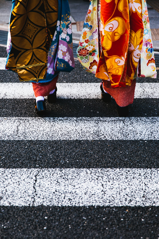 Japanese geisha crossing street
