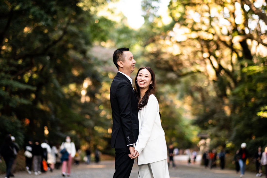 Couple laughs at Meiji Shrine entrance