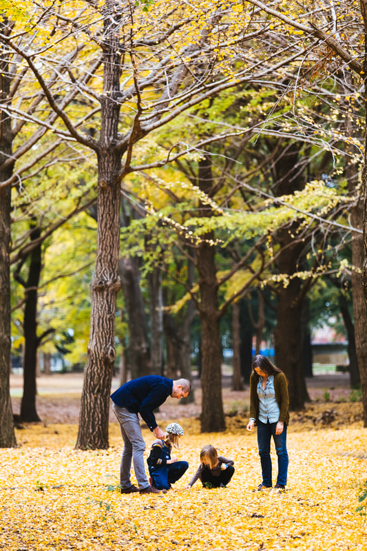 family in autumn leave