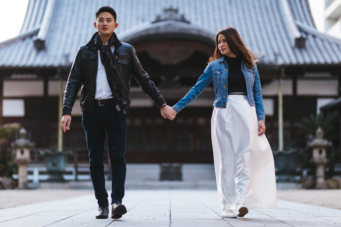 Couple holding hands at temple