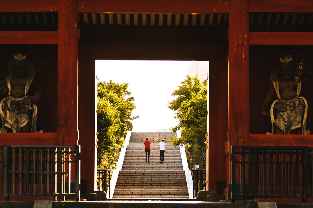 couple climbing temple stairs
