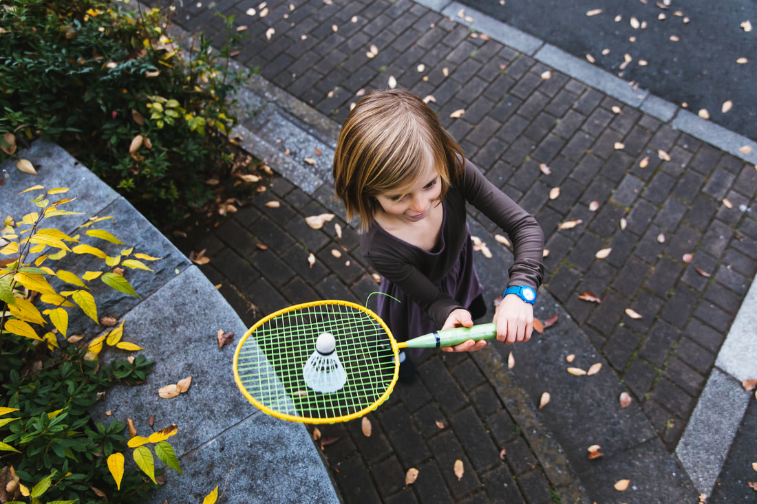 girl holding badminton racket