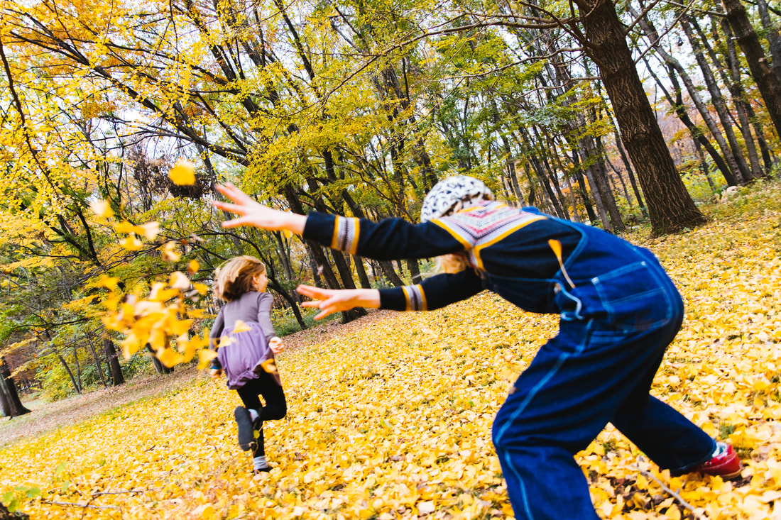 throwing leaves in Nogawa Park