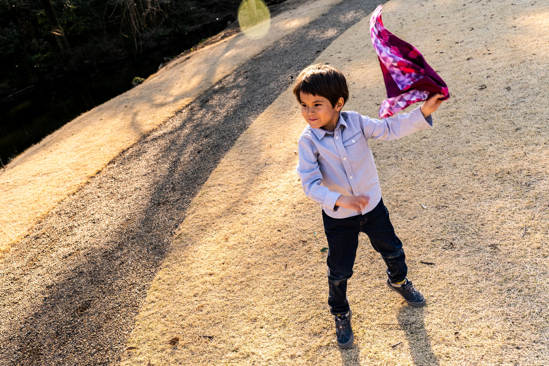 child playing with scarf